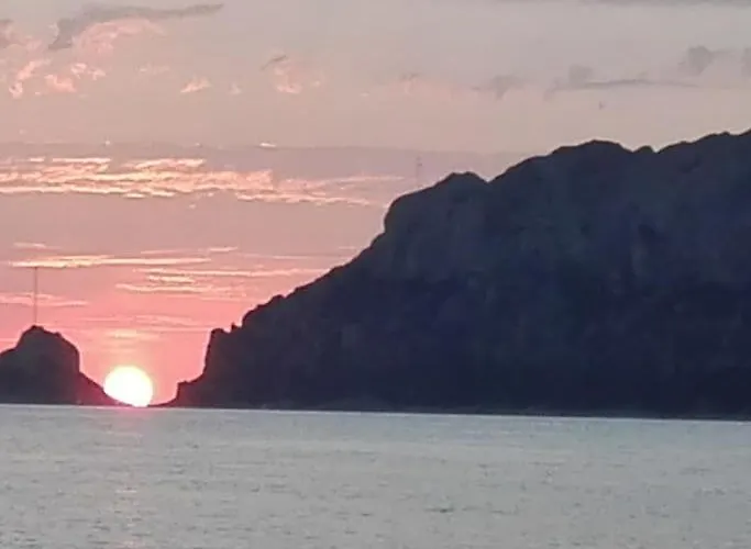 Sleeping On A Boat In The Island's Bay Porto San Paolo (Sardinia)