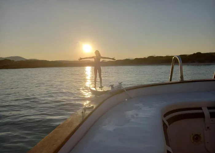 Sleeping On A Boat In The Island's Bay Porto San Paolo (Sardinia)