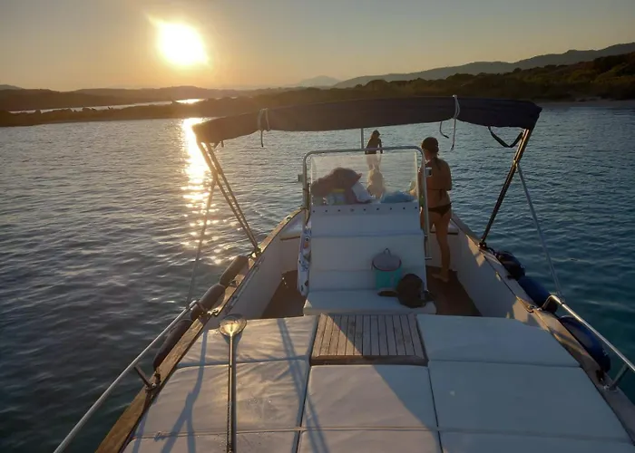 Sleeping On A Boat In The Island's Bay Porto San Paolo (Sardinia)