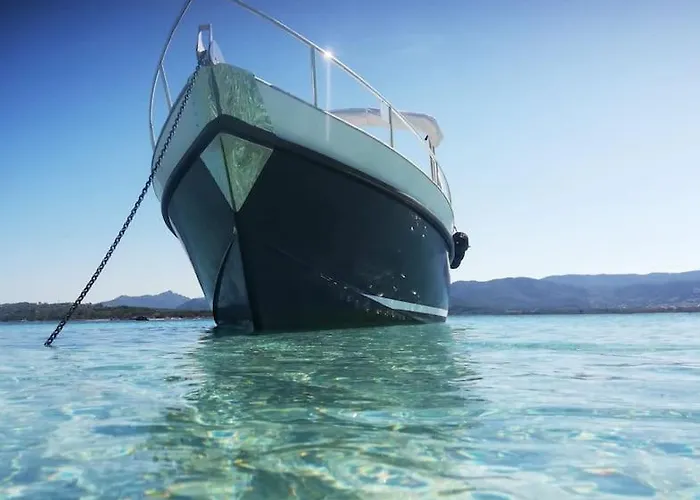 Sleeping On A Boat In The Island's Bay Porto San Paolo (Sardinia)