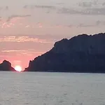 Sleeping On A Boat In The Island's Bay Porto San Paolo (Sardinia)