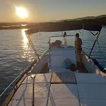 Sleeping On A Boat In The Island's Bay Porto San Paolo (Sardinia)