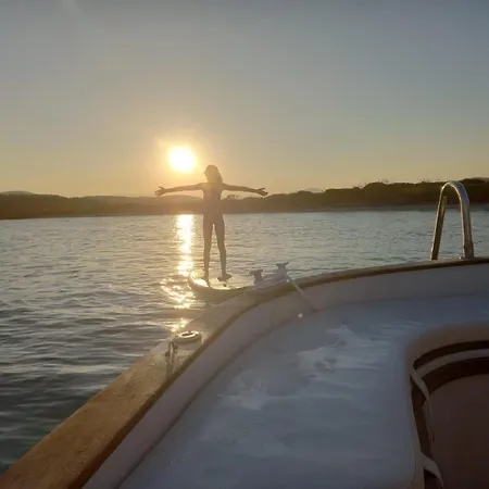 Sleeping On A Boat In The Island's Bay Porto San Paolo (Sardinia)