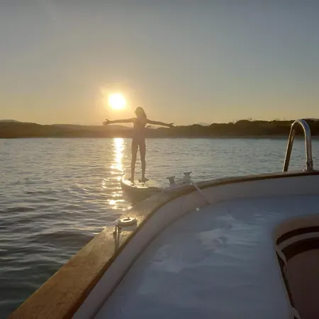 Sleeping On A Boat In The Island's Bay Porto San Paolo (Sardinia)
