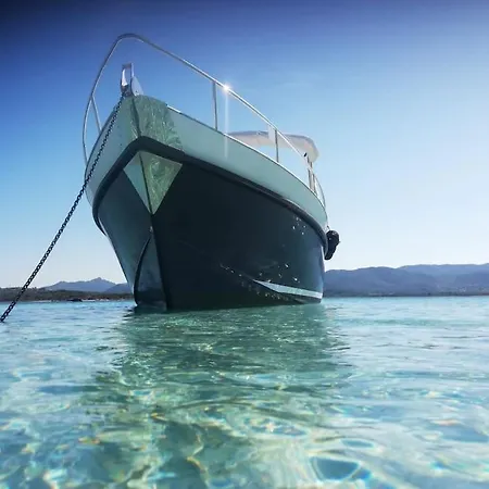 Sleeping On A Boat In The Island's Bay Porto San Paolo (Sardinia)