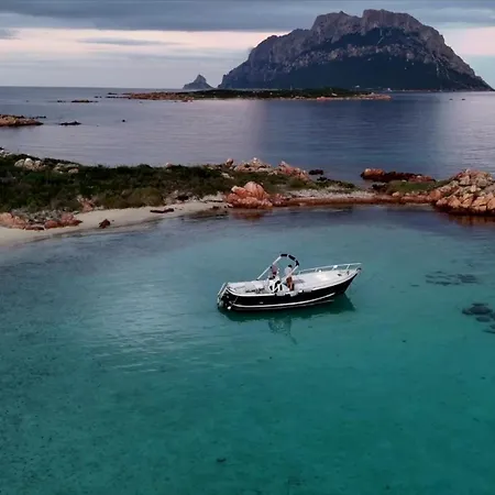 Botel Sleeping On A Boat In The Bay Porto San Paolo (Sardinia)