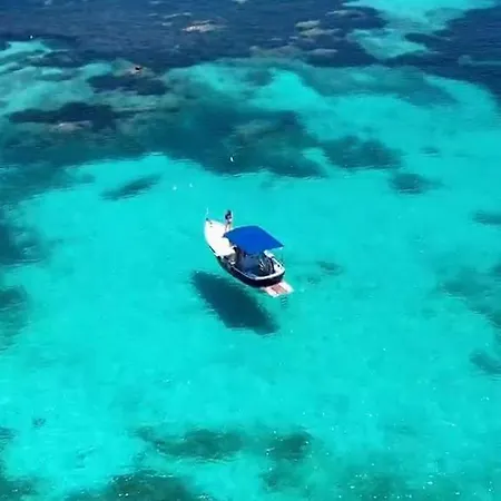 Sleeping On A Boat In The Island's Bay Porto San Paolo (Sardinia)